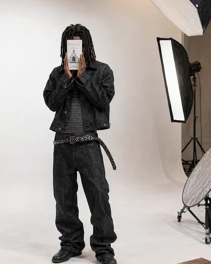 Model holding a phone to their face, studio